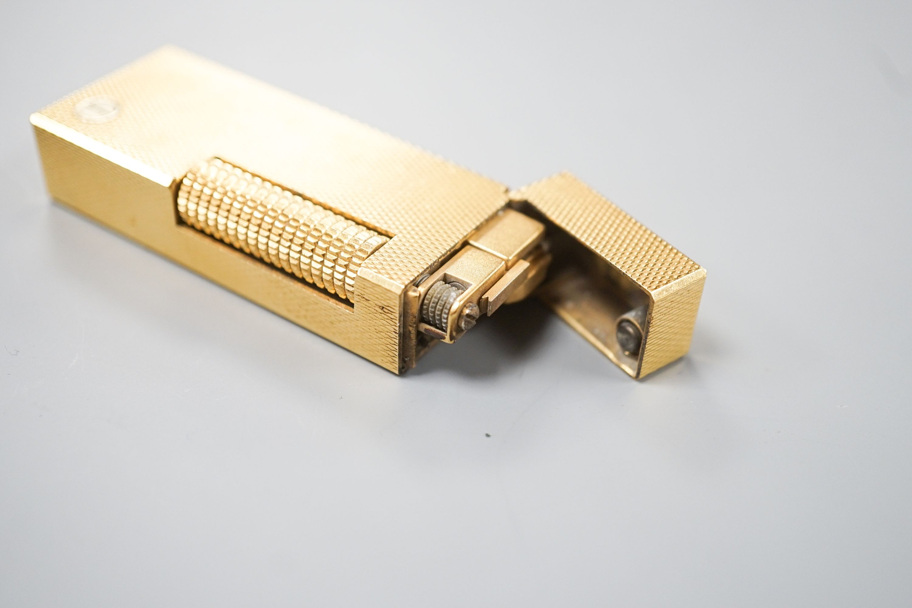 A cased Dunhill gold plated lighter